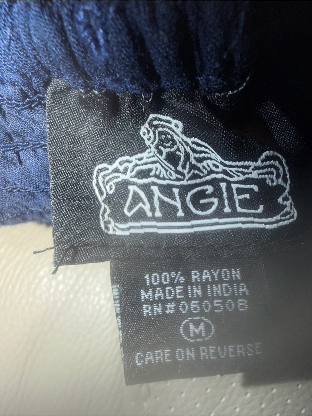 Angie’s Women’s Navy Eyelet Smocked Peasant Top - Picture 7 of 7